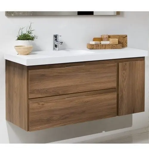 Vanitory flotante de madera con doble cajón y mesada blanca, ideal para baños minimalistas y funcionales.